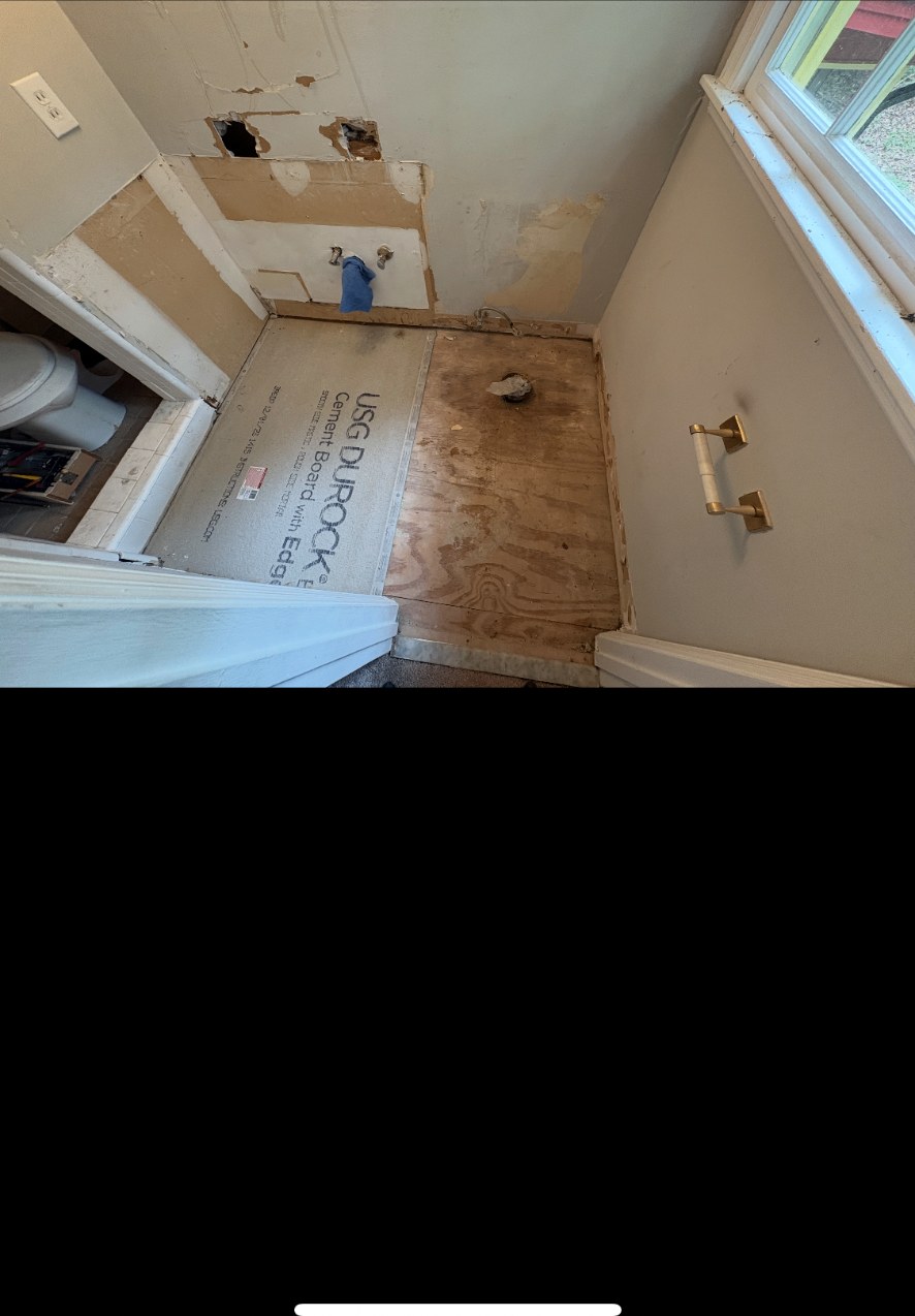 Bathroom LVP Floor — Gainesville, GA — before the remodel, dated built-in tub deck